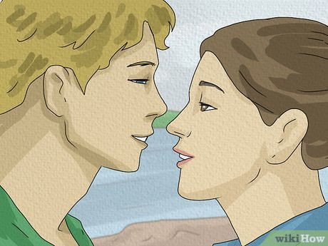 If he's grinning, it's because he's excited to be kissing you!