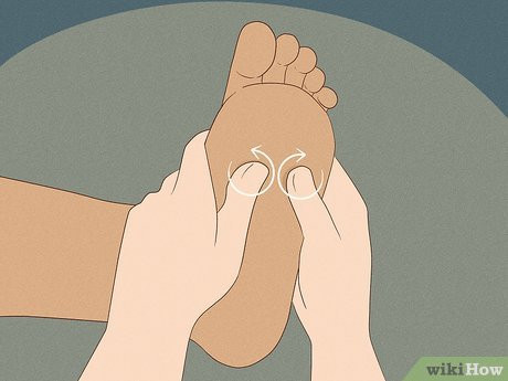 Step 3 Massage the arch of her foot with your thumbs.