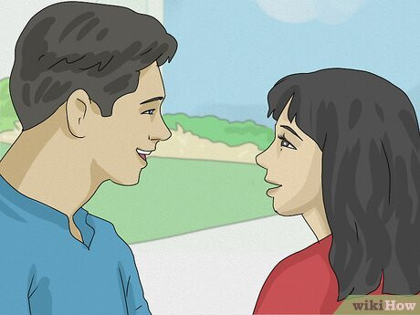 A man and woman talking and smiling.